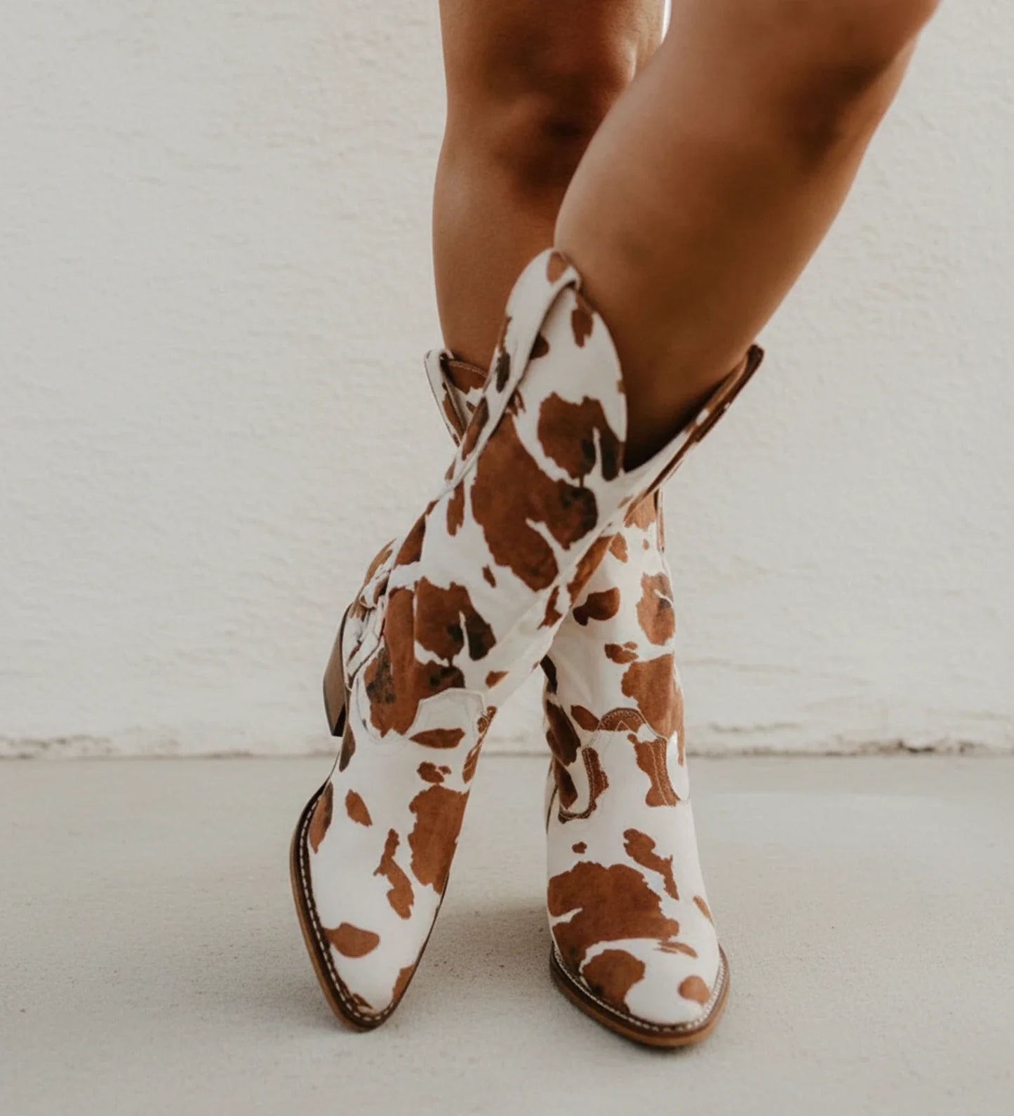 Western Boots in Cow Print Design in Brown - front view